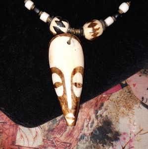 Tribal mask and beaded necklace hook clasp